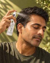 Load image into Gallery viewer, Man spraying Bio Follicle Normal treatment spray at his hairline
